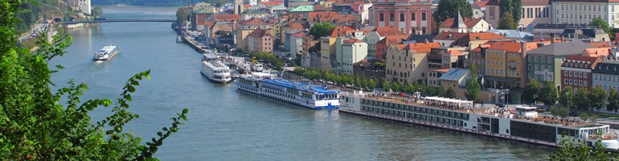 River ships moored along a city quay